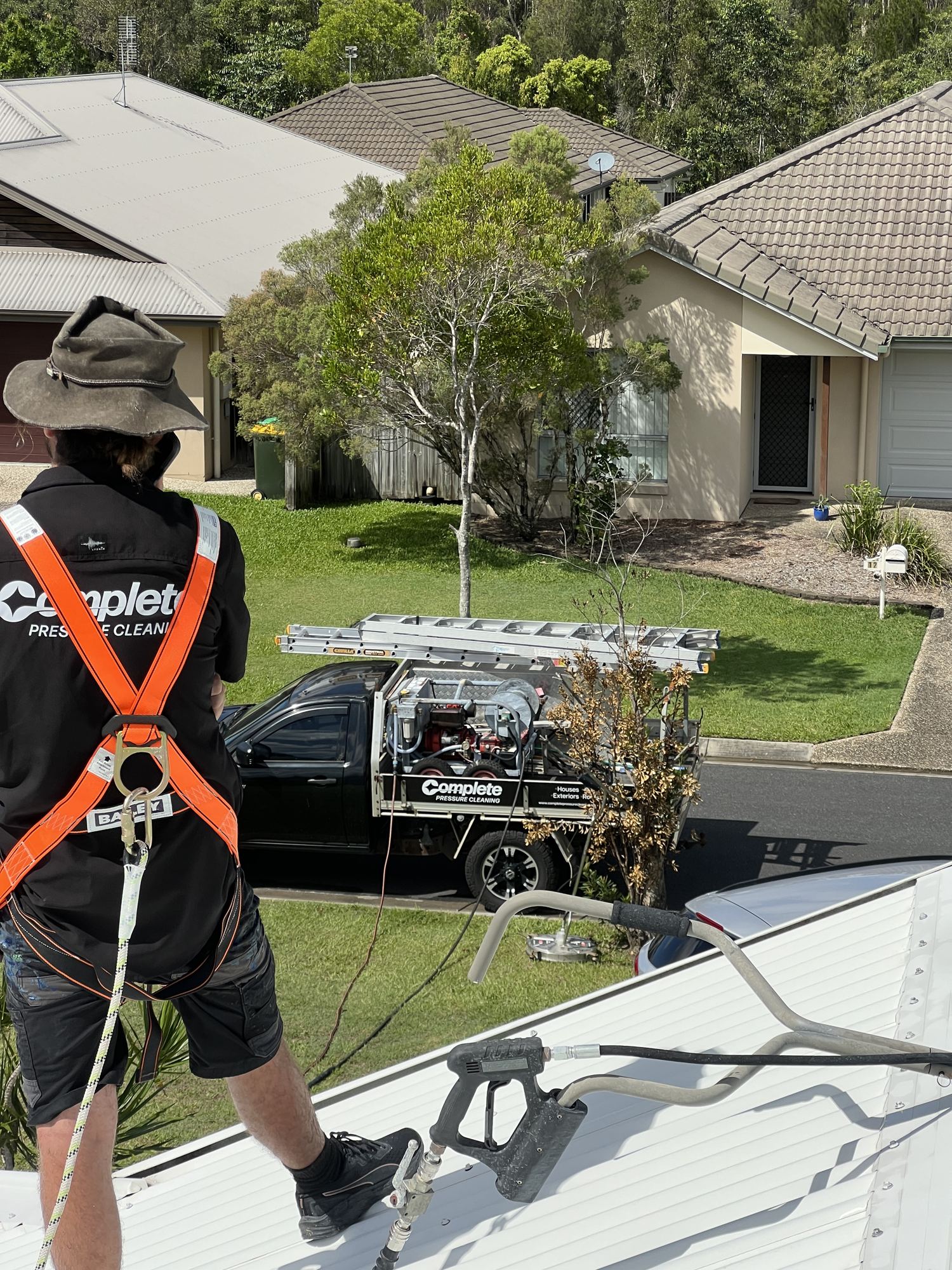 Operator on a roof in a safety harness